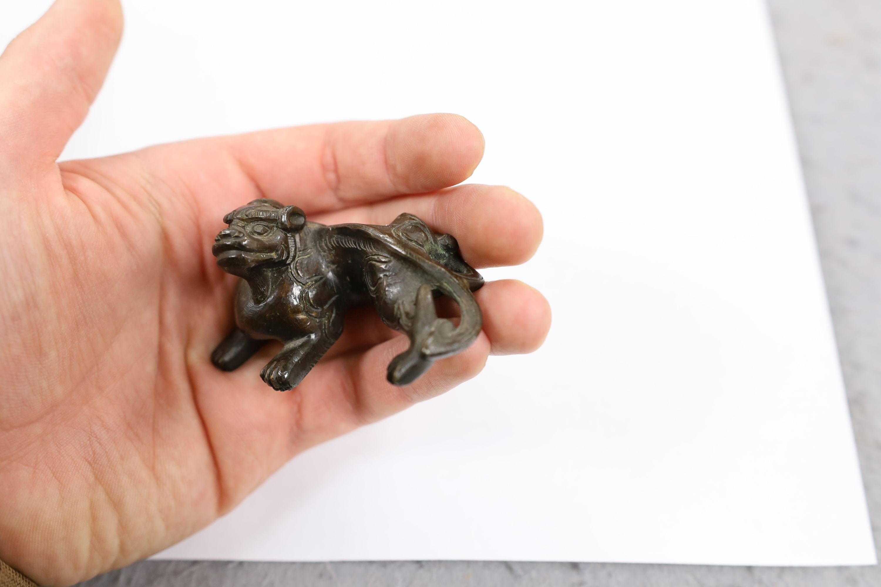 Five Chinese or Tibetan bronze figures or Buddhist implements, tallest 13cms high